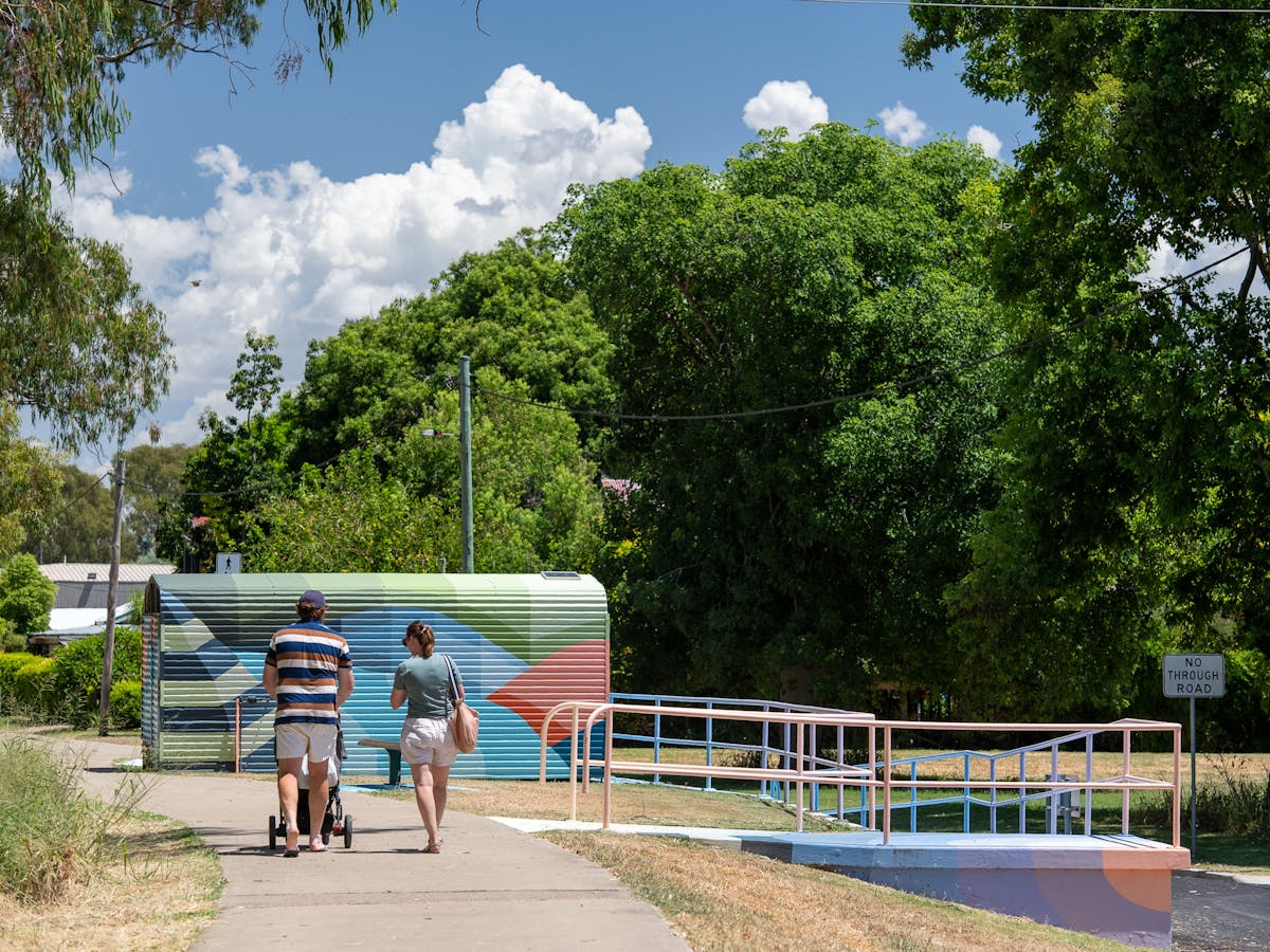Couple walking along the riverwalk in Goondiwindi