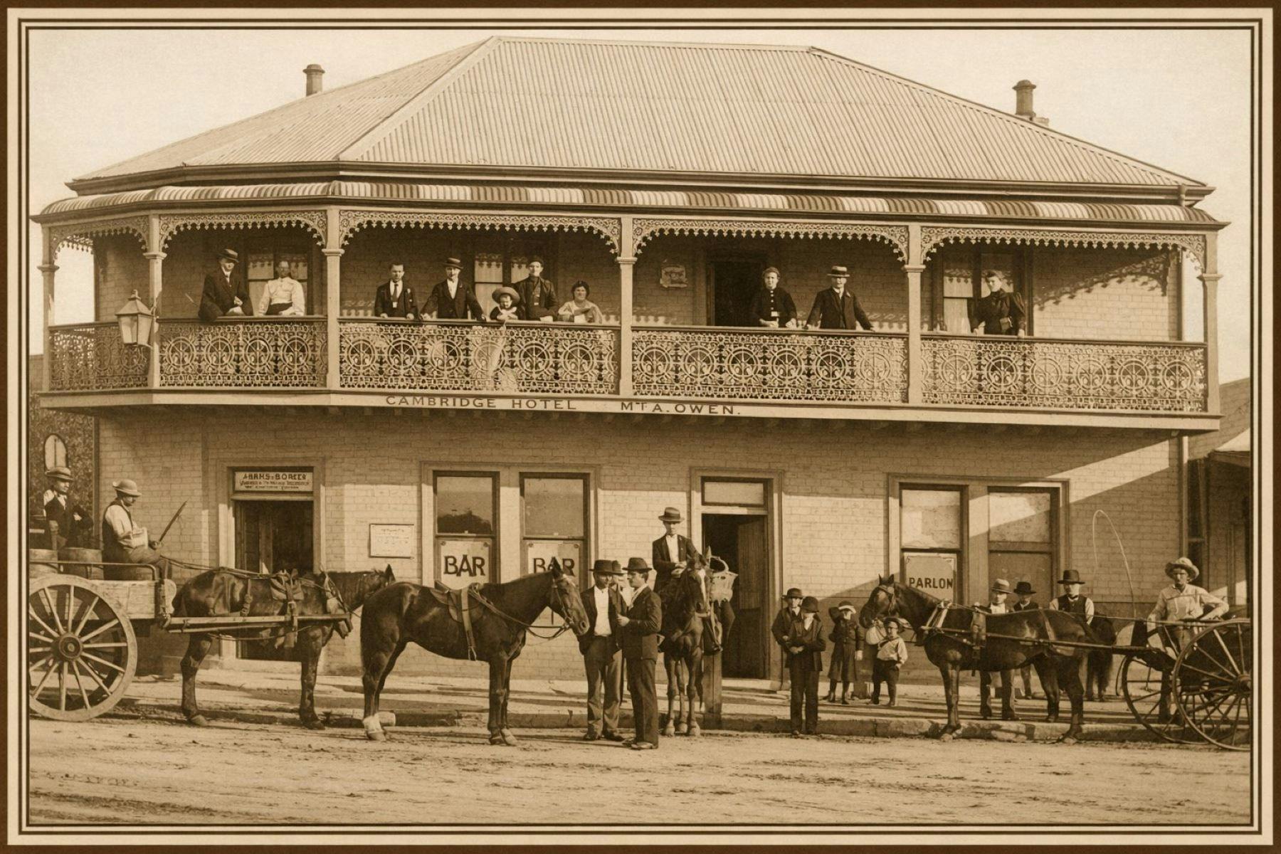 Hotel pictured with guests on upper verandah and horse and carts and patrons  on the road