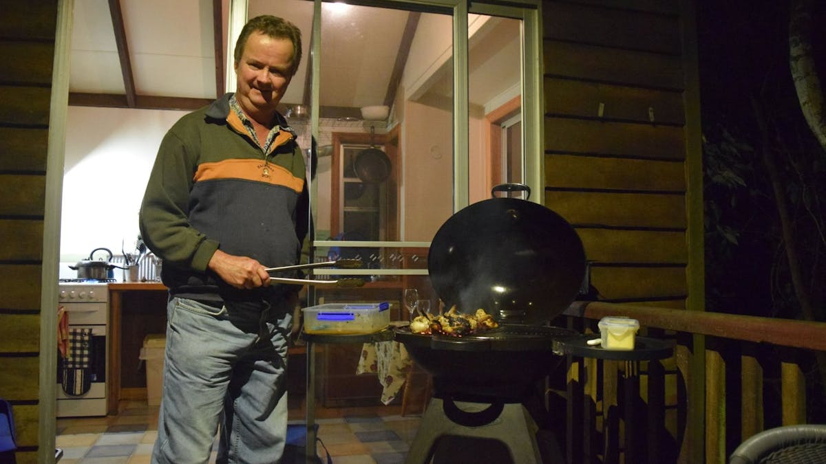 Cooking on the BBQ on the veranda of the cabin
