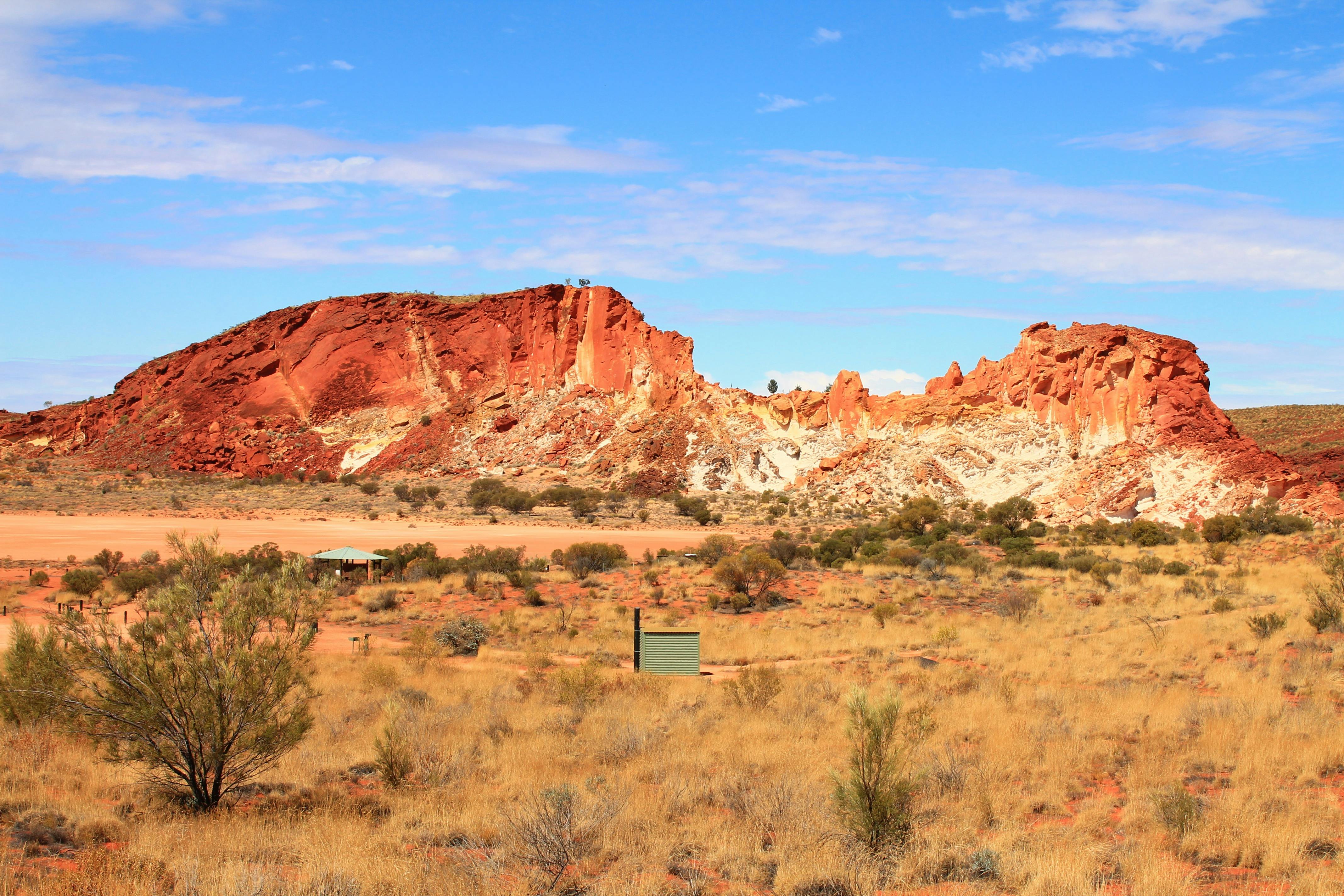 Rock cliff in shades of red and white