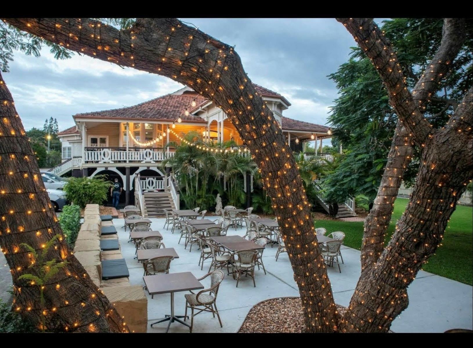 Outside view of Gray's Bar and Restaurant with fairy lights on tree
