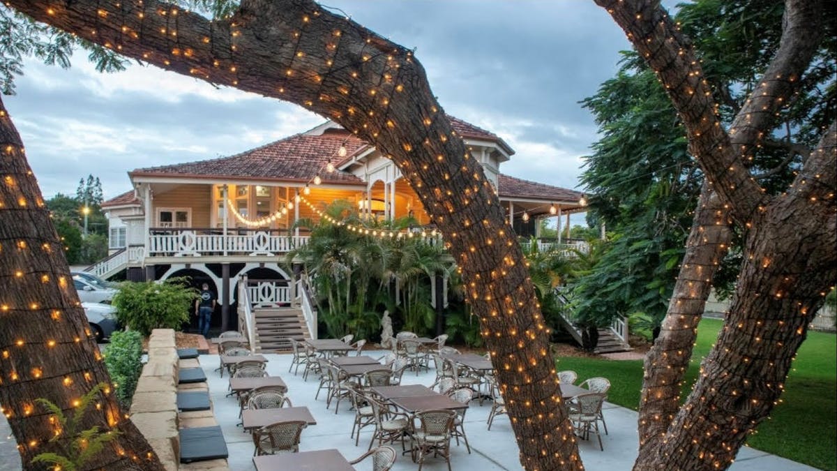 Outside view of Gray's Bar and Restaurant with fairy lights on tree