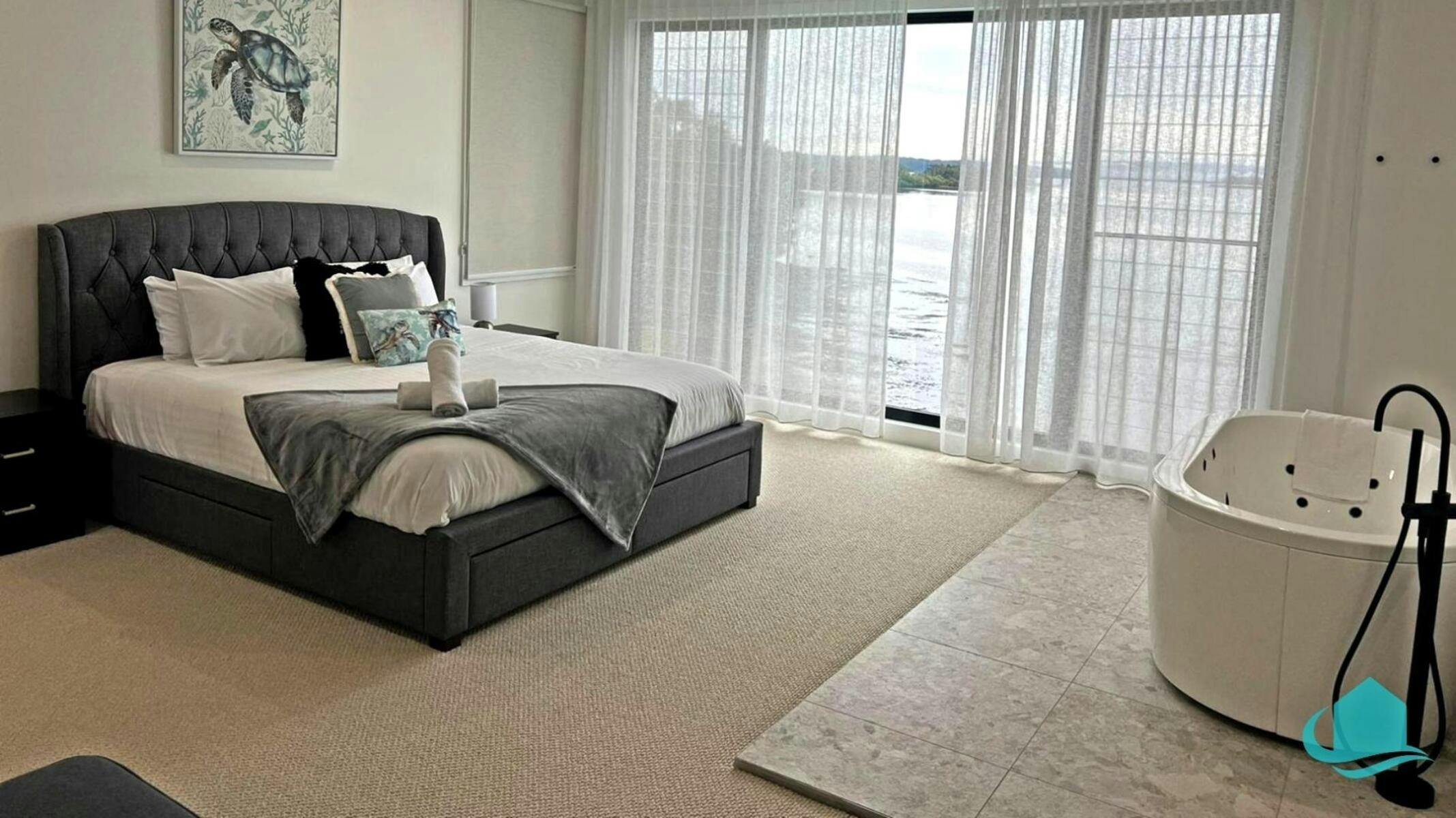 Main bedroom stand alone bath with lake views