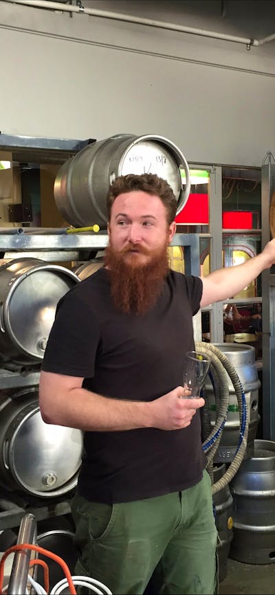 Men in the barrel room at Wig & Pen