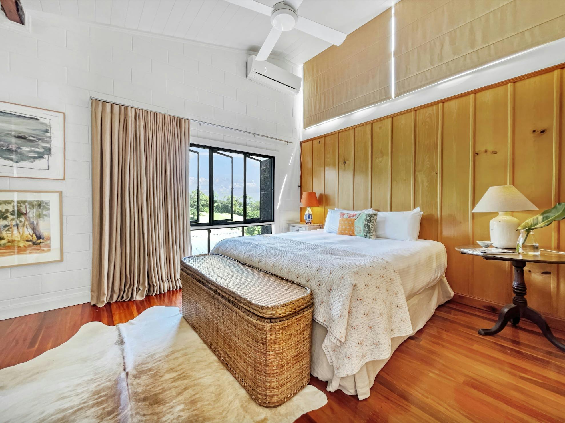 Wake to panoramic views from the king-sized bed in the primary suite.