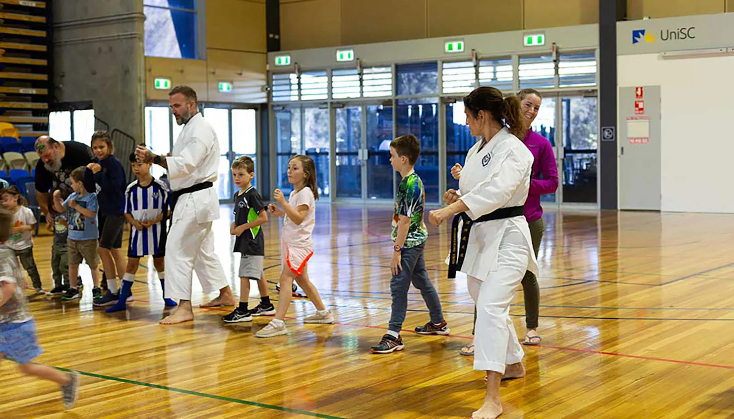 Kids trying martial arts at the Education Fair 2023