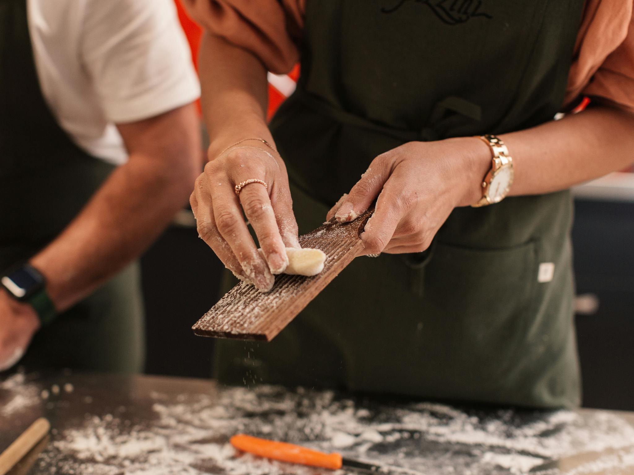 Person making pasta at Pizzini Cooking School