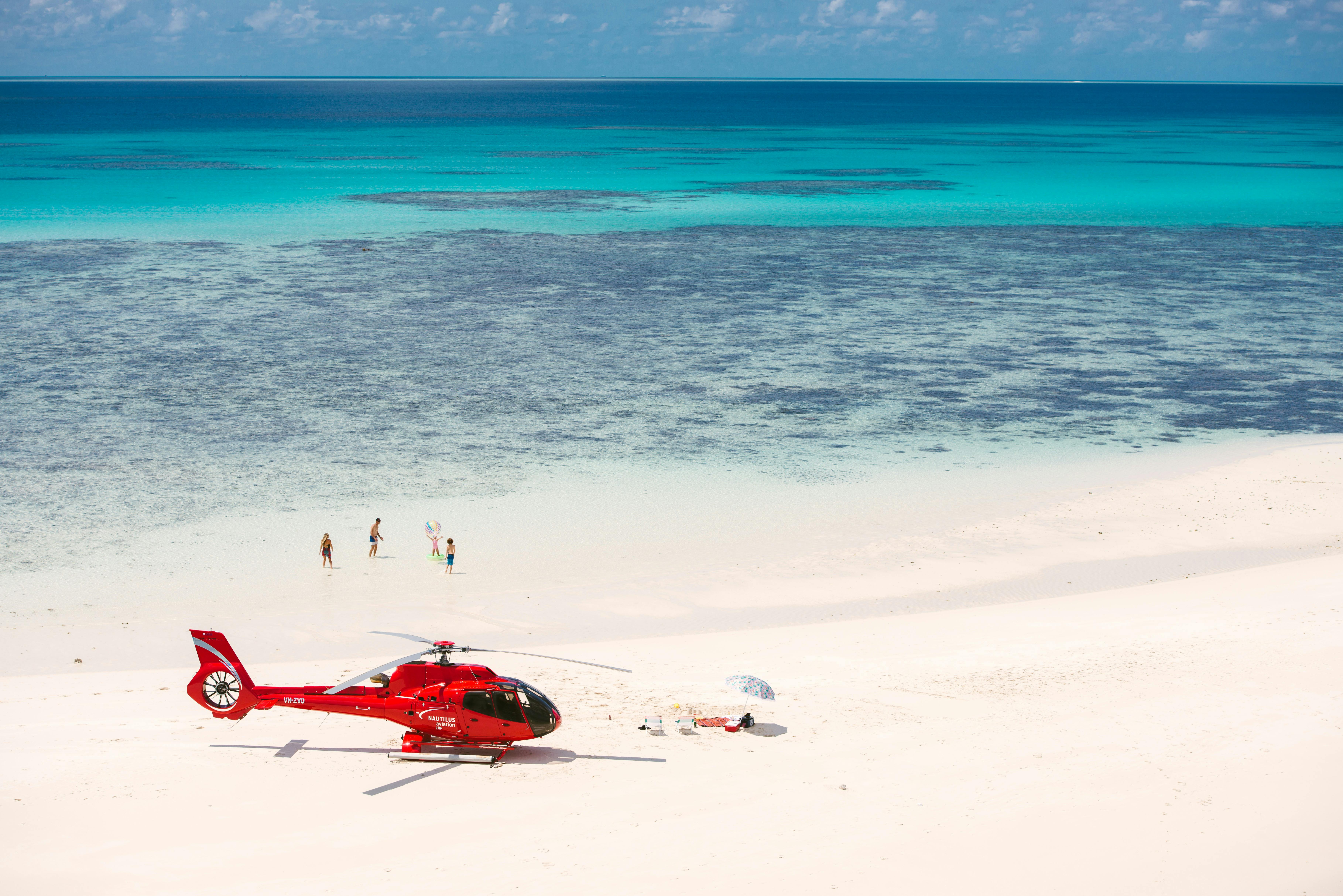 Heli and people on a sand cay Great Barrier Reef
