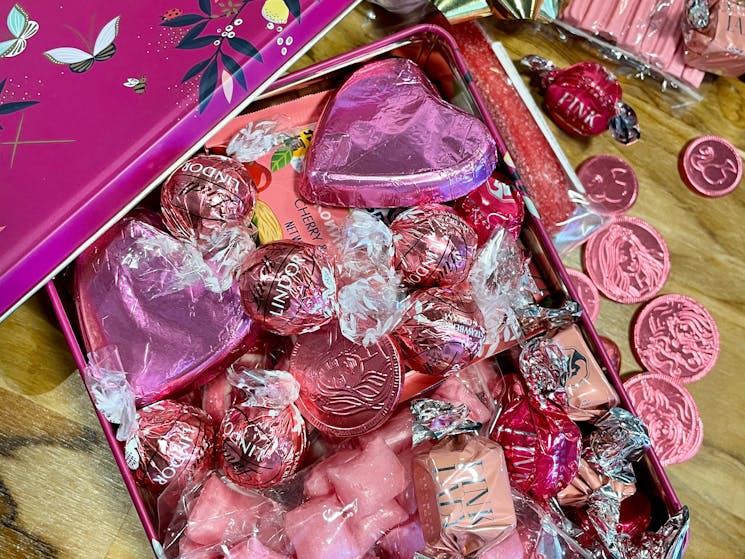 Chocolates and Sweets with a pink theme. Turkish Delight, Heart shaped Chocolate, Musk Sticks