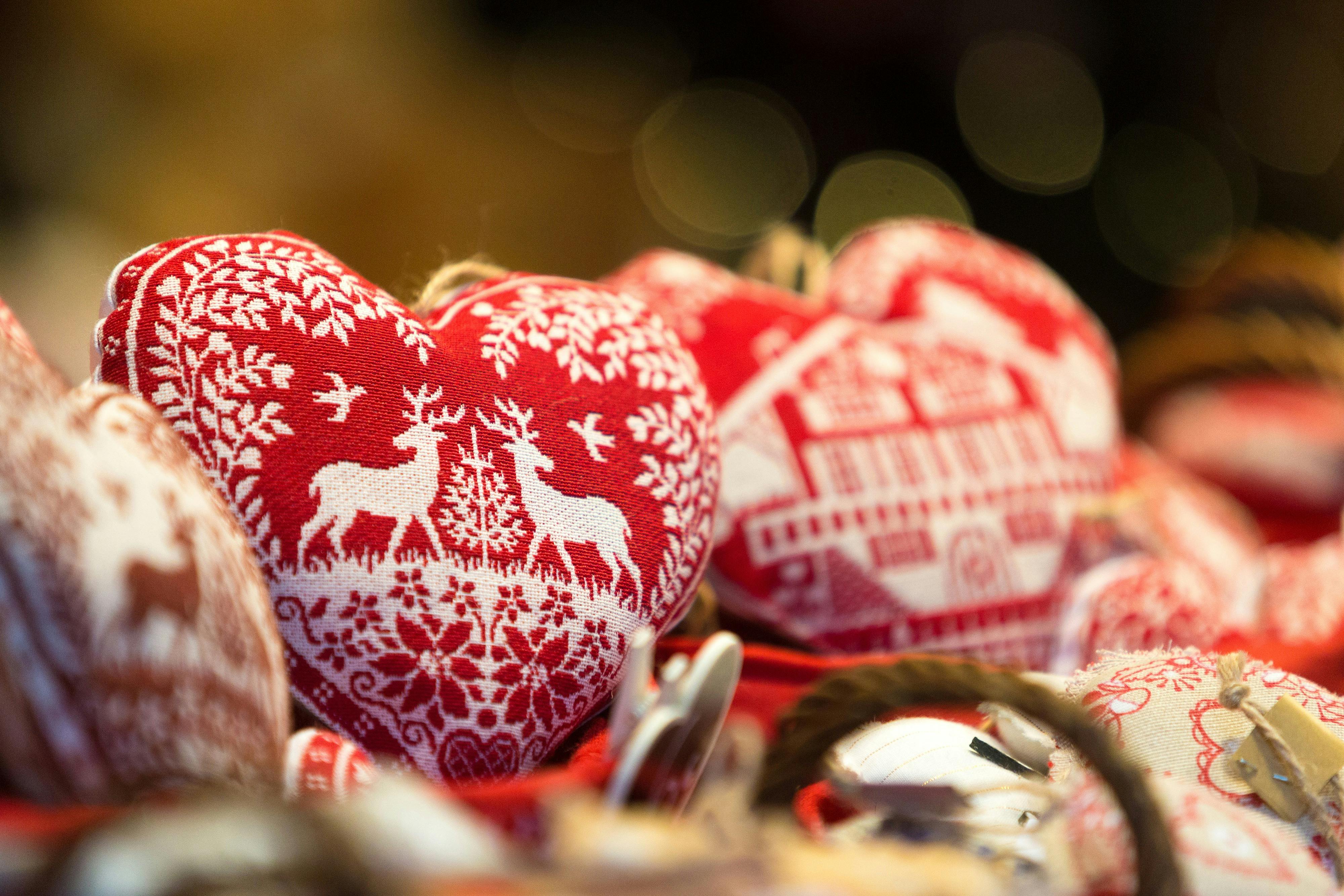 Heart shaped Christmas ornaments on display at a market