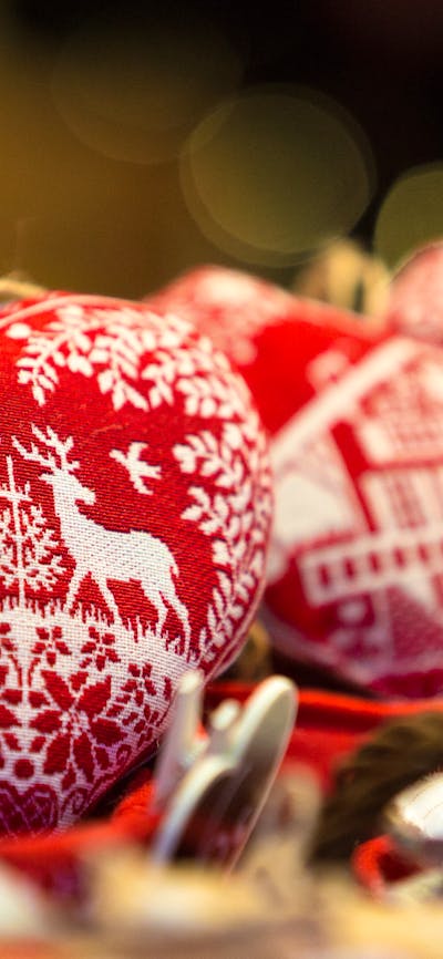 Heart shaped Christmas ornaments on display at a market