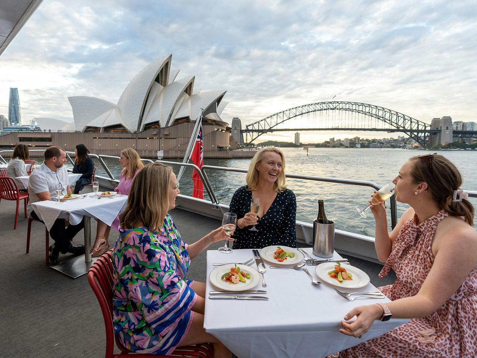 Guests enjoying a unique waterfront dining experience on Magistic Xmas party cruise on the harbour