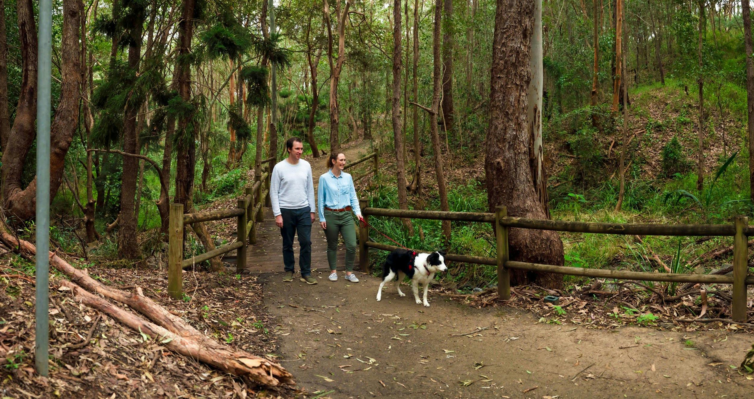 People walking their dog on walking track
