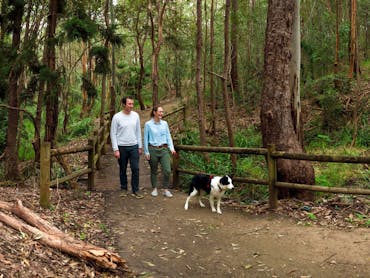 People walking their dog on walking track