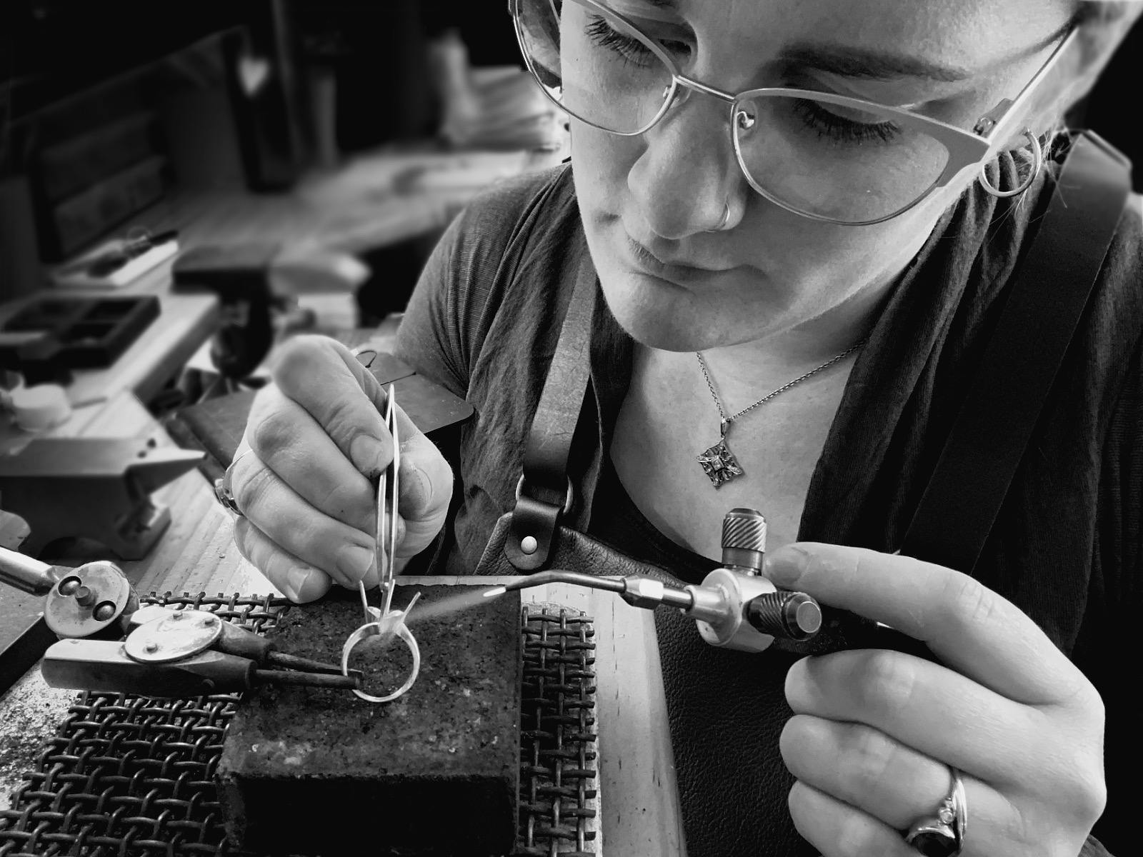 Emily setting gemstones in a hand-made ring