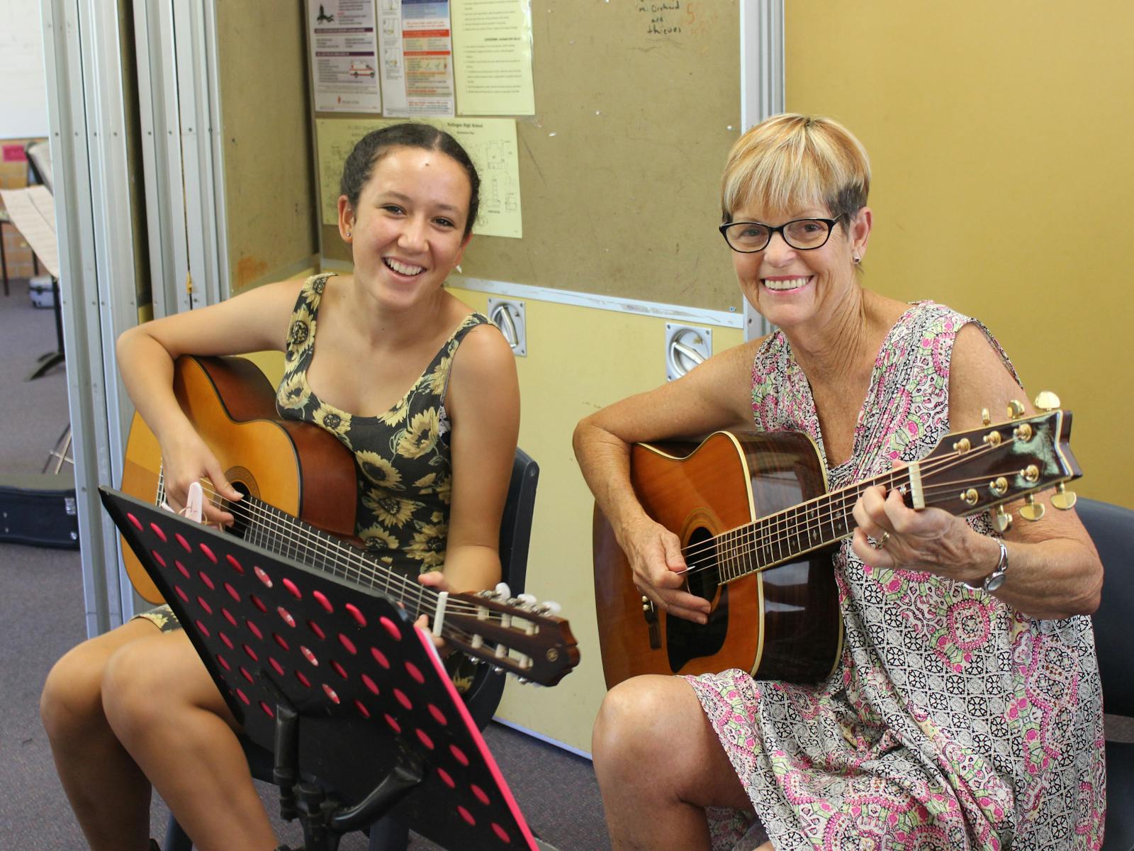 Girl and woman with guitar