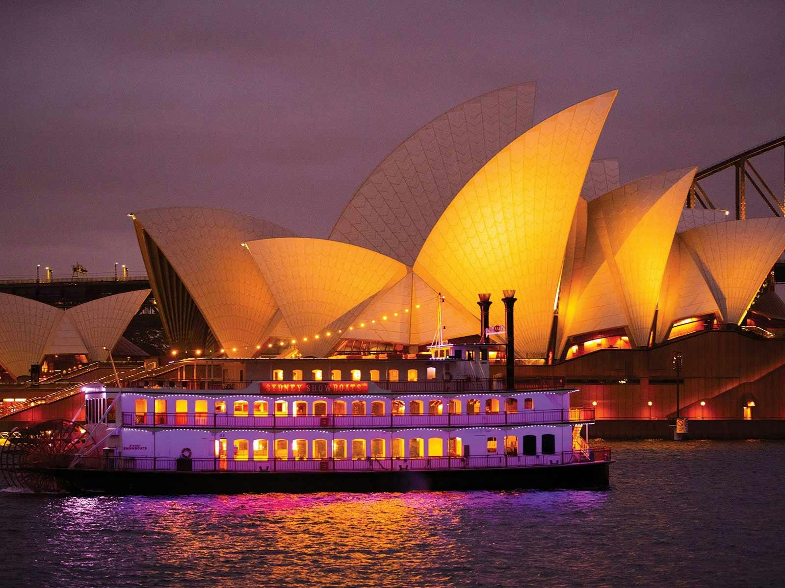 Showboat cruising past Opera House