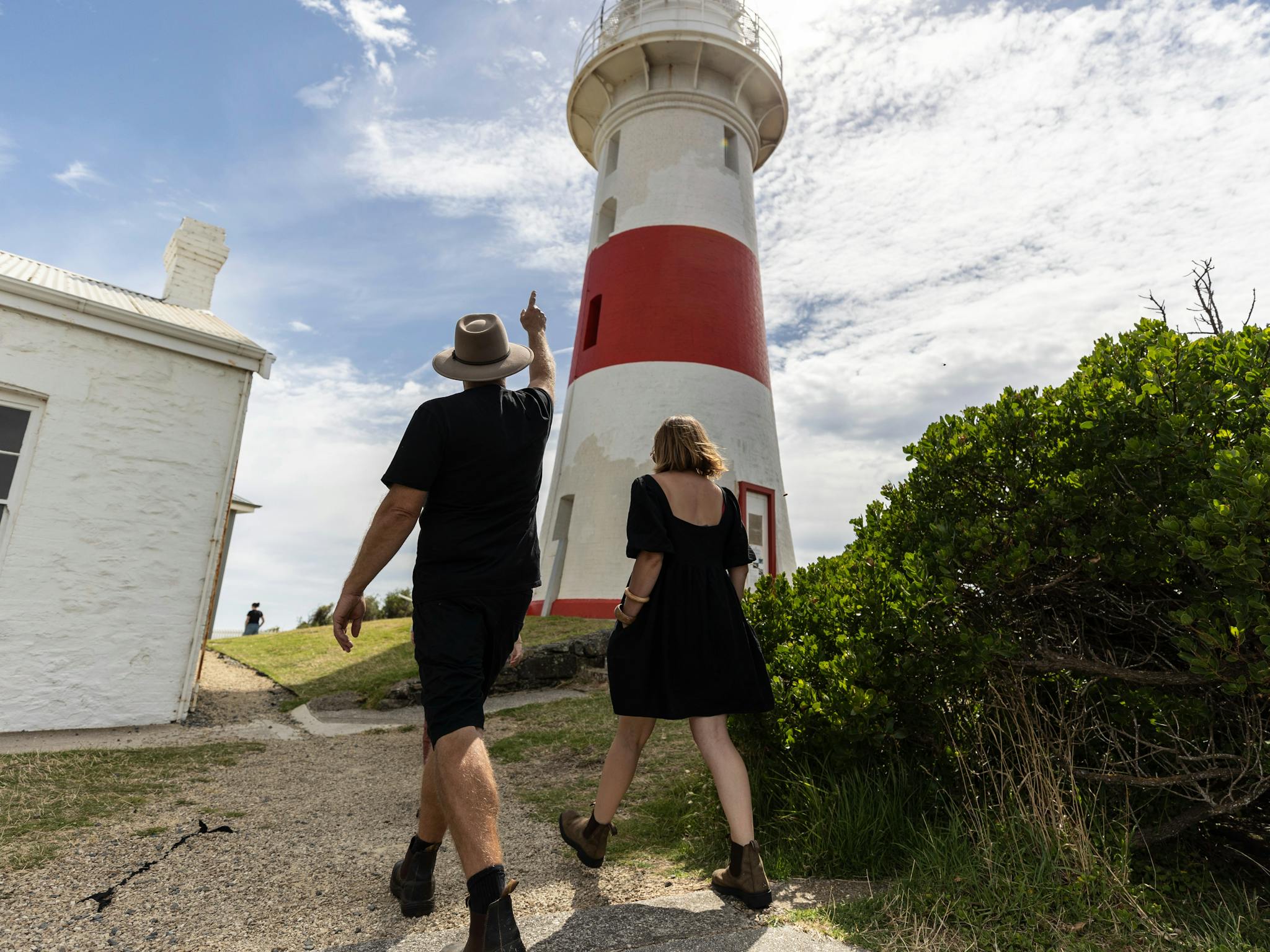 Couple walking to lighthourse