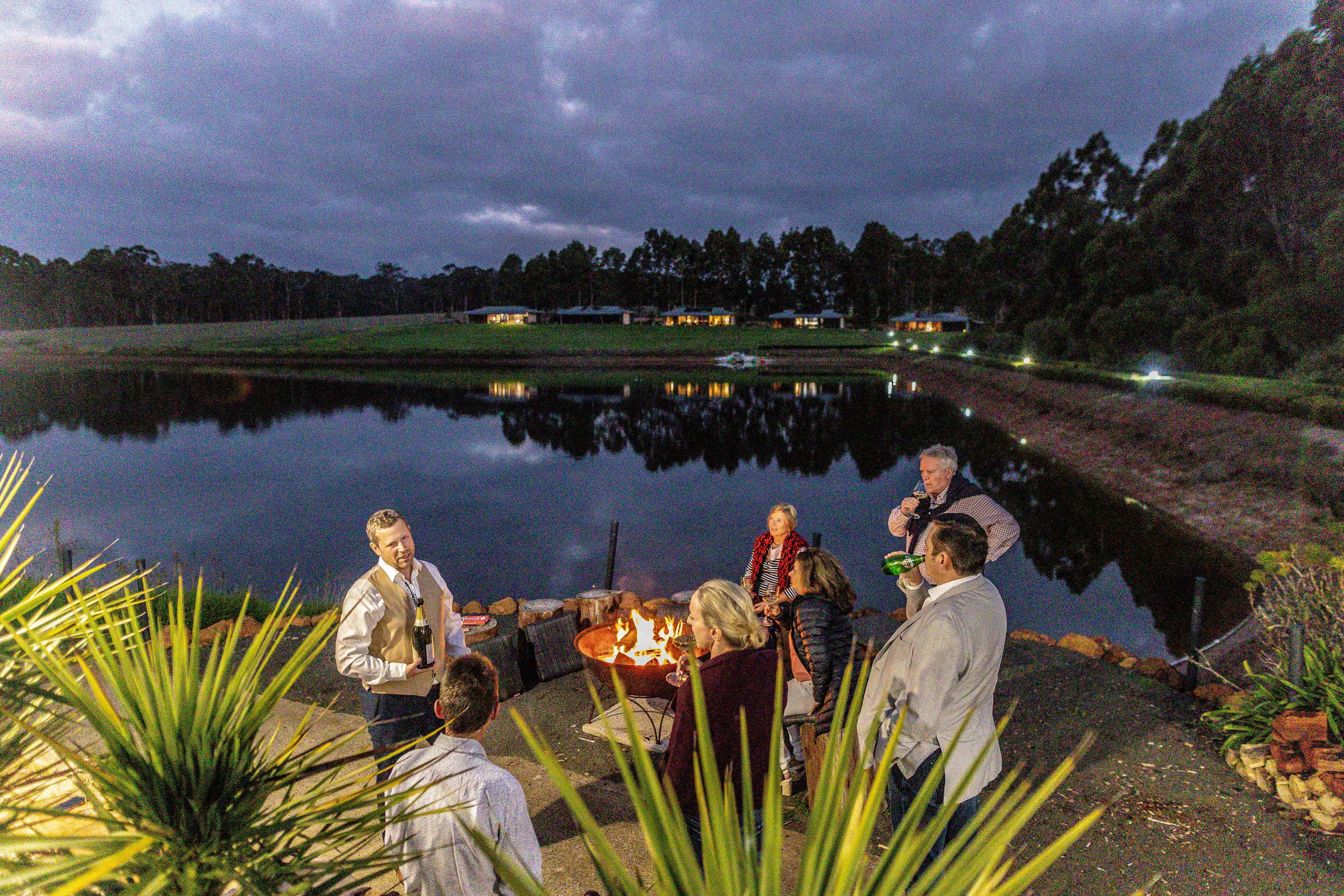 Warming up around open fire at Tanah Marah