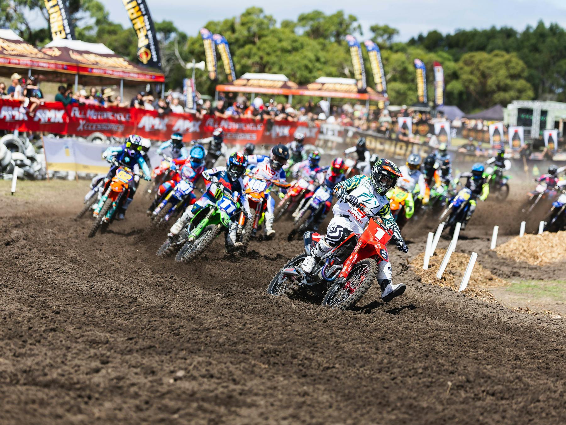 A pack of racers come around the first turn