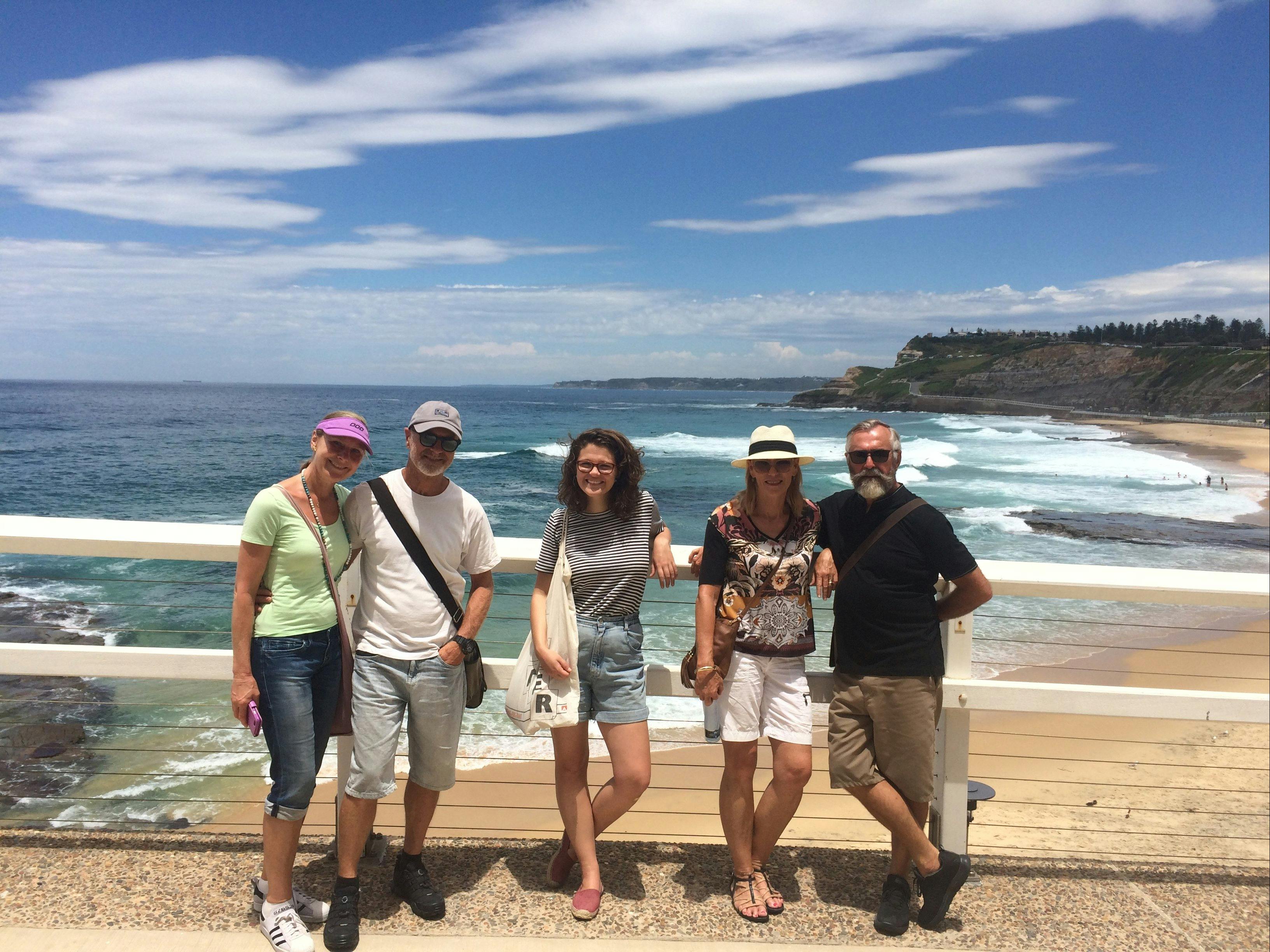 Visitors at the beach on the Seascapes to Laneways walking tour with Newcastle Afoot