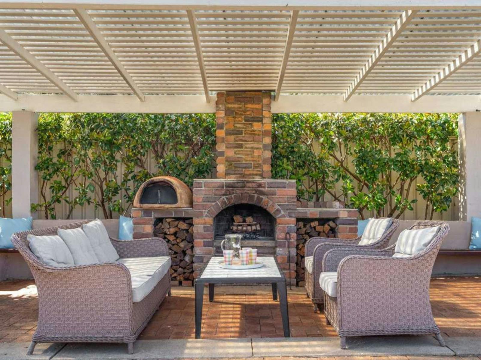 Perfect Lounge Area for cosy nights at home with outdoor lounge chairs and open fire.