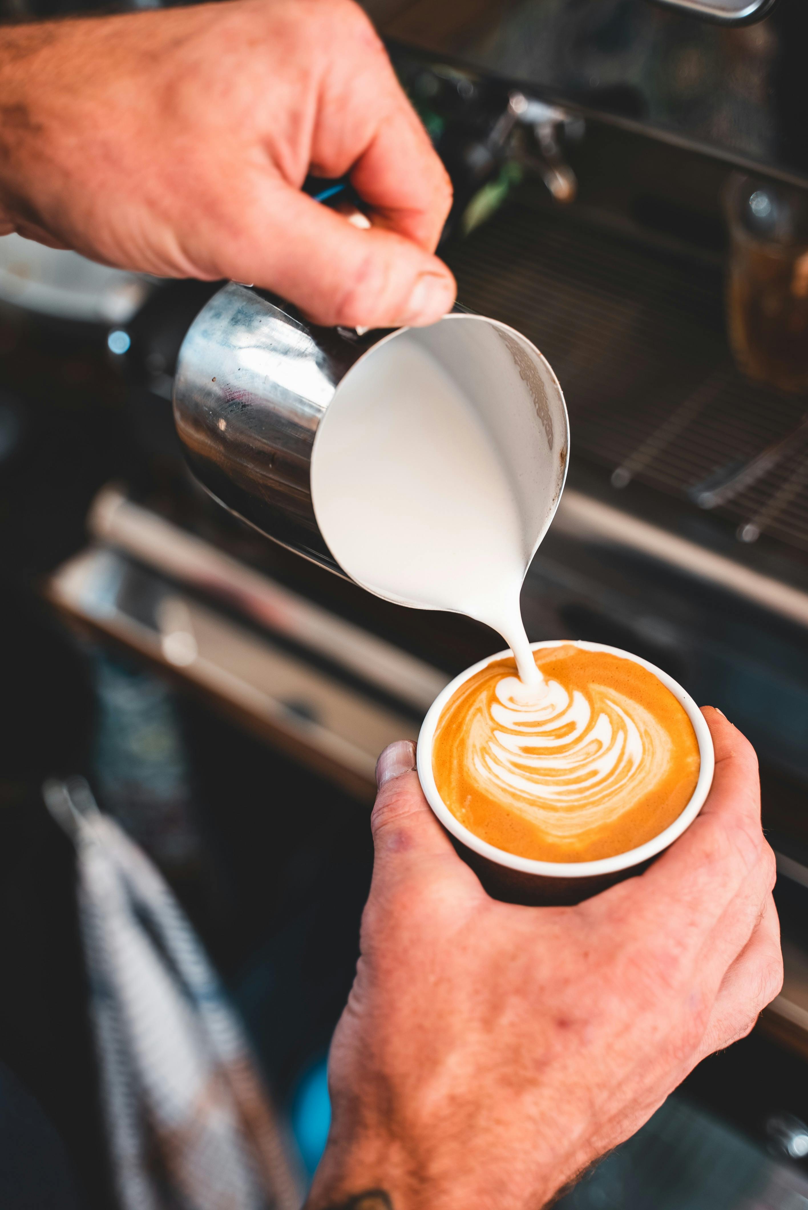 Close up shot of Michael pouring a coffee