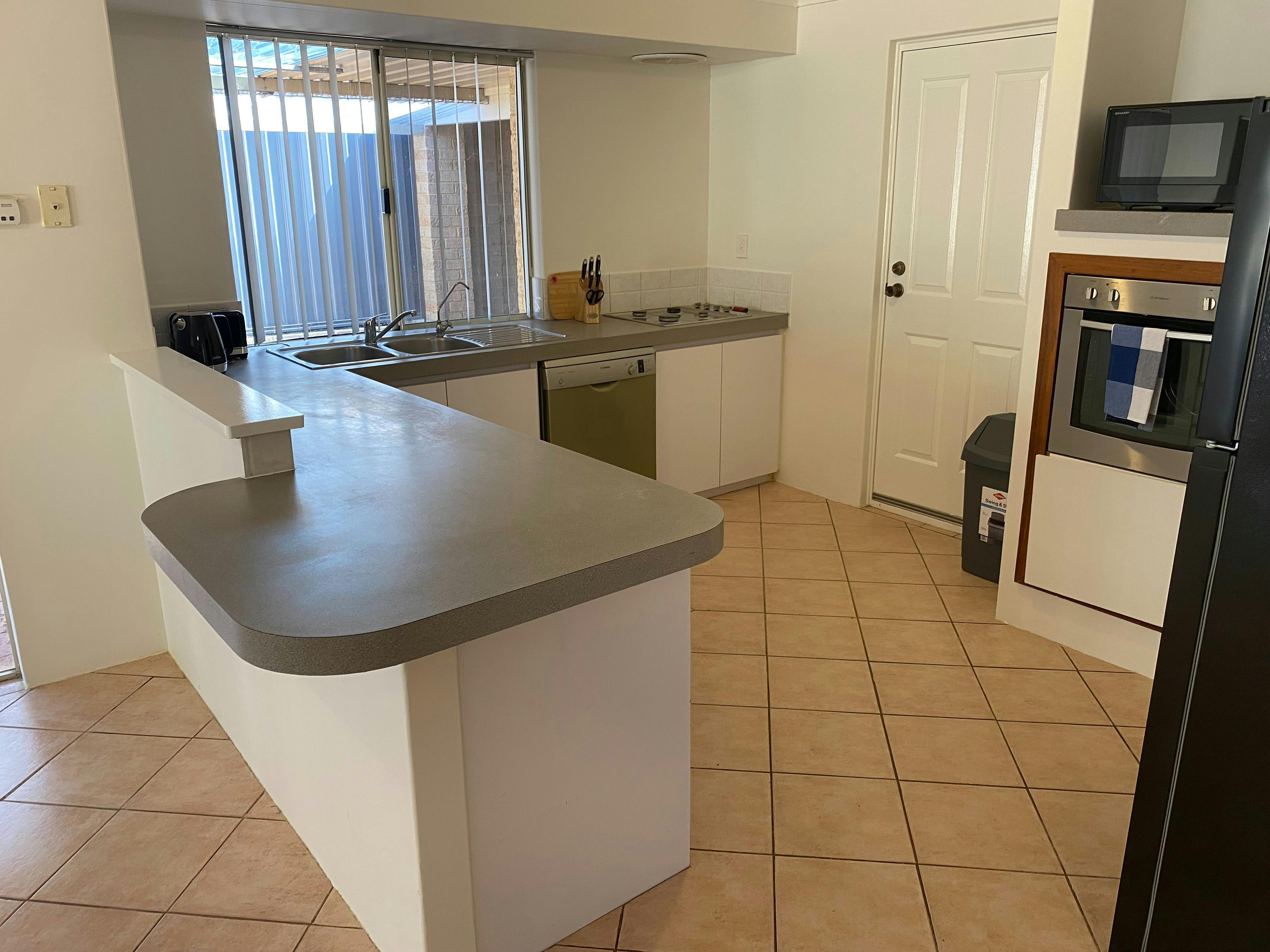Full kitchen with dishwasher