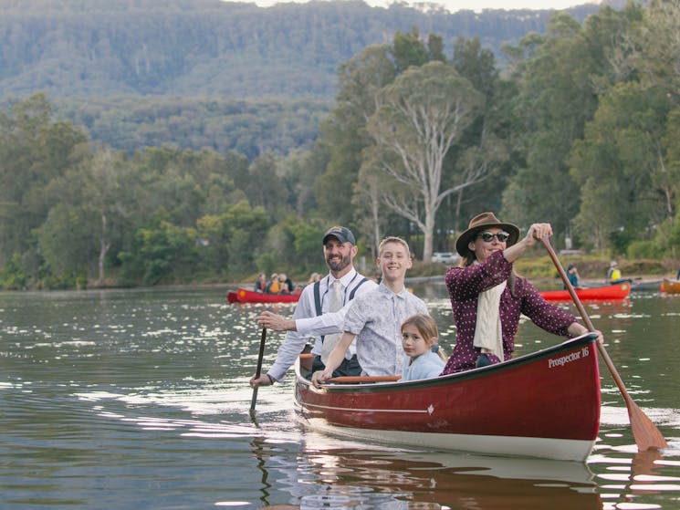 Family of 4 in formal wear canoeing