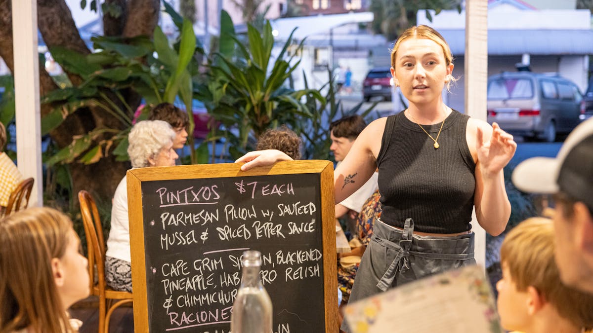 Katie with Specials board at Seabean Tapas Bar Restaurant, Port Douglas, Tropical North Queensland