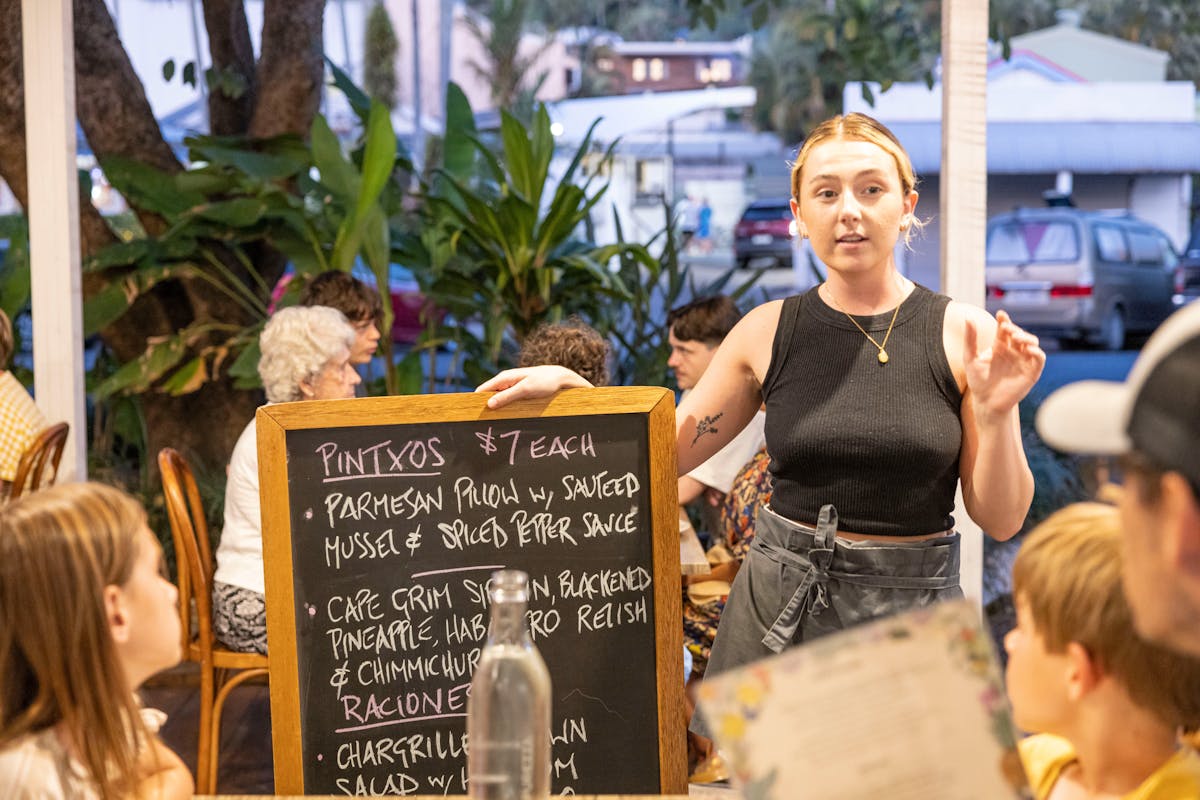 Katie with Specials board at Seabean Tapas Bar Restaurant, Port Douglas, Tropical North Queensland