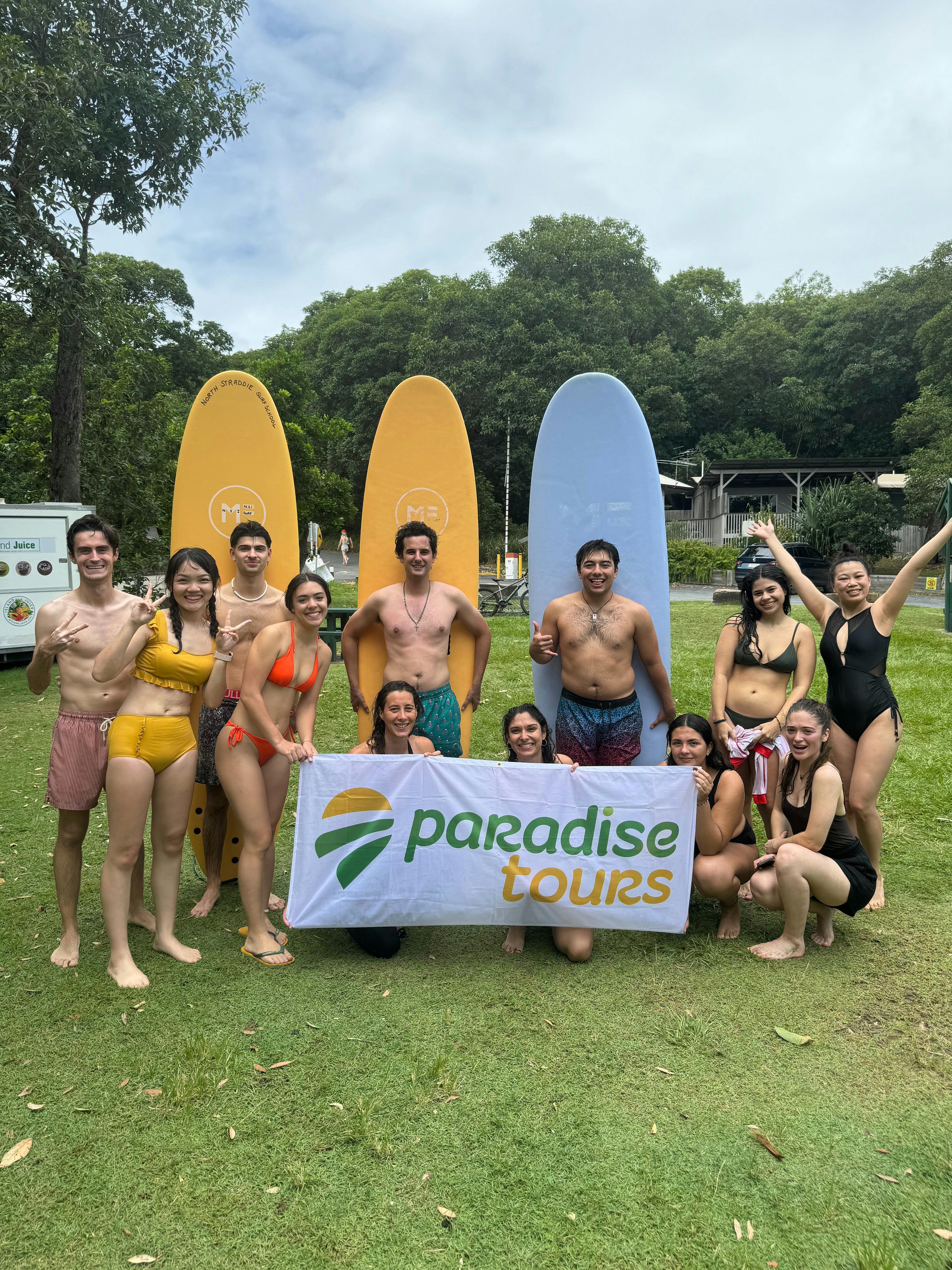 Group Photo with Paradise Tours Banner - North Stradbroke Island