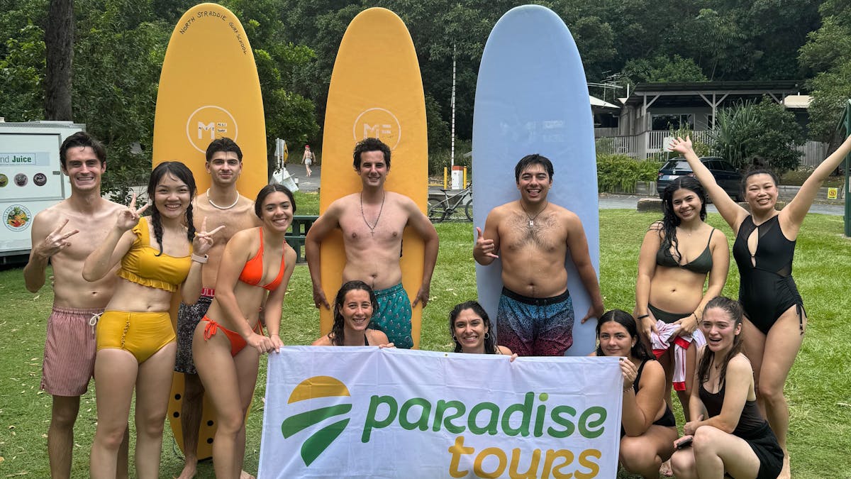 Group Photo with Paradise Tours Banner - North Stradbroke Island