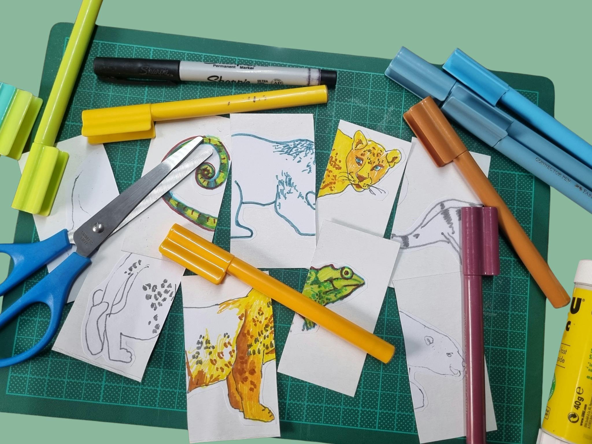 drawings of animals, markers glue and scissors