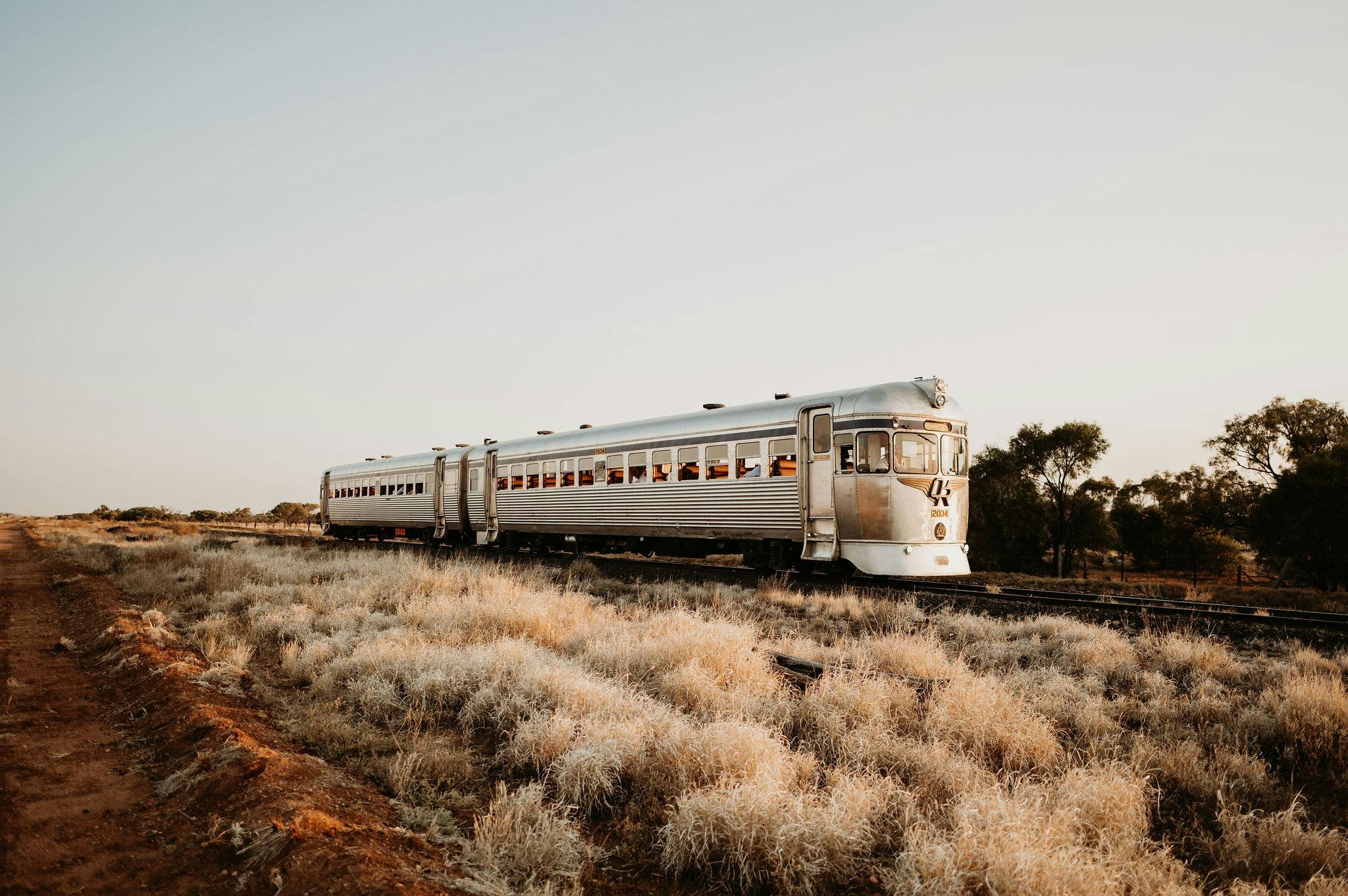 Silver bullet train in an outback paddock sunset rail experience with Outback Aussie Tours.