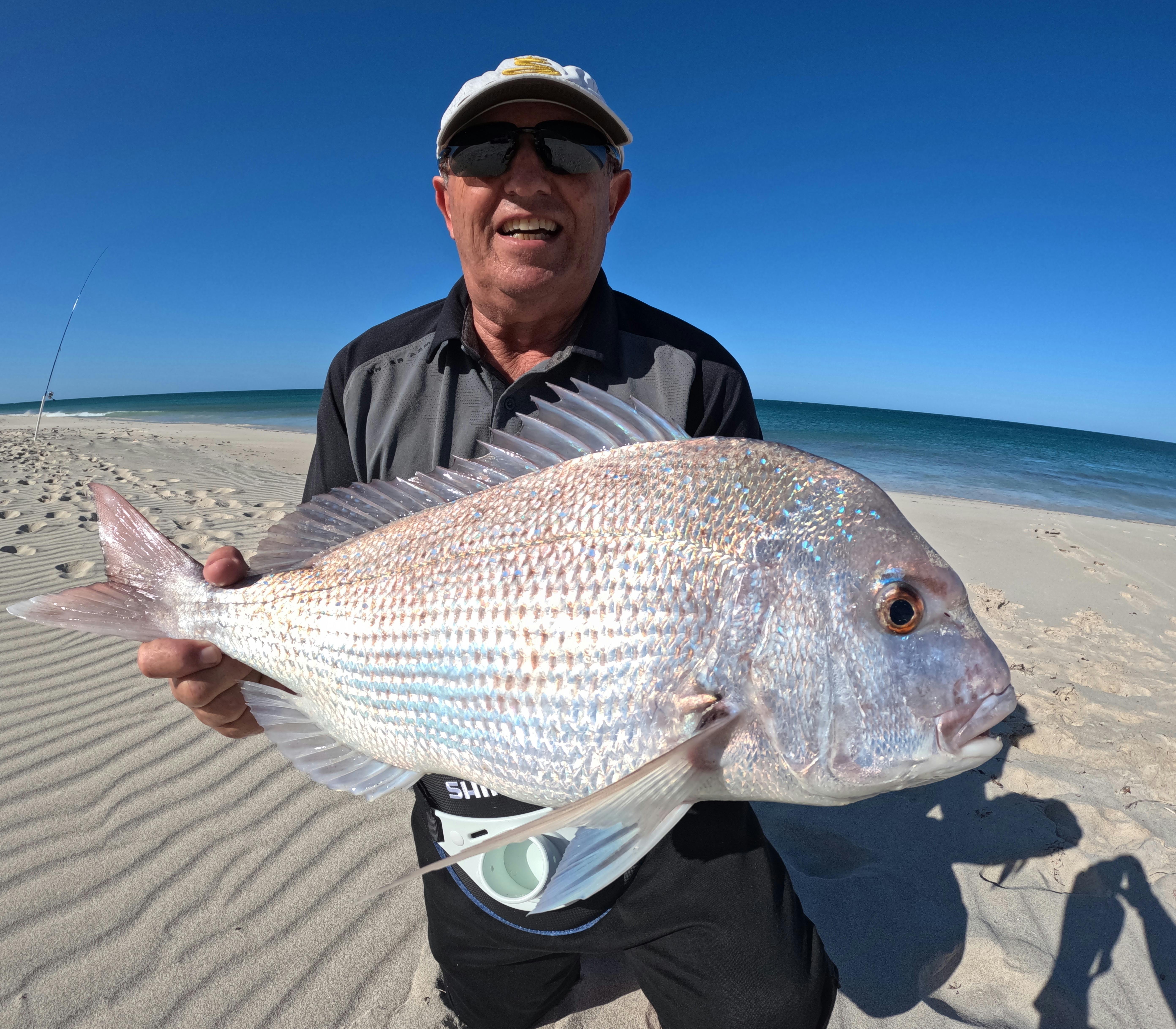 A Beach Buoy Fishing Mission customer holding his 8Kg Landbeased Pink Snapper caught on a drone