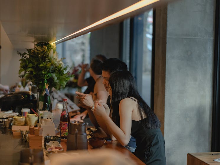 Two people dining at Amuro