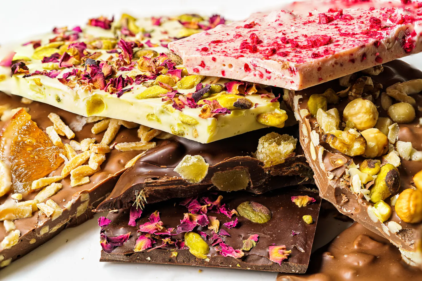 selection of colourful chocolate bars piled on top of each other