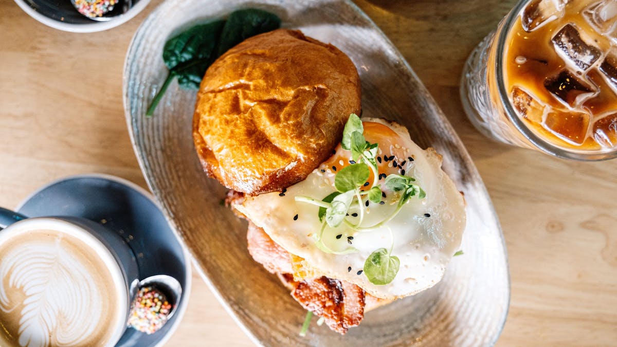 bacon | egg | spinach | housemade hash | bbq  sauce | toasted bun |