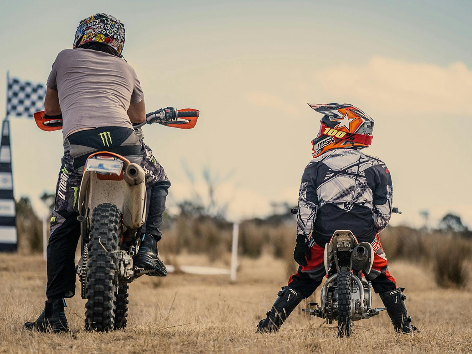 A Father and Son sitting on their motorcycles contemplating their next ride at Spoke.