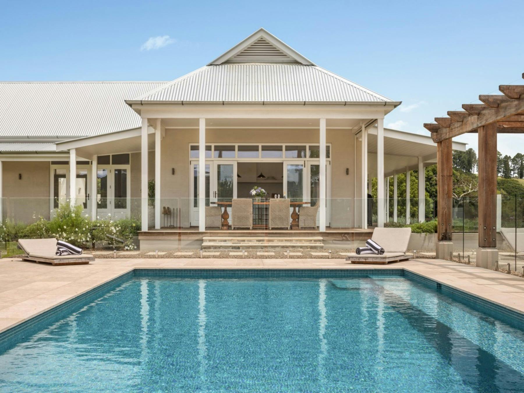 Swimming pool overlooking landscaped gardens and countryside at Stonehaven Estate