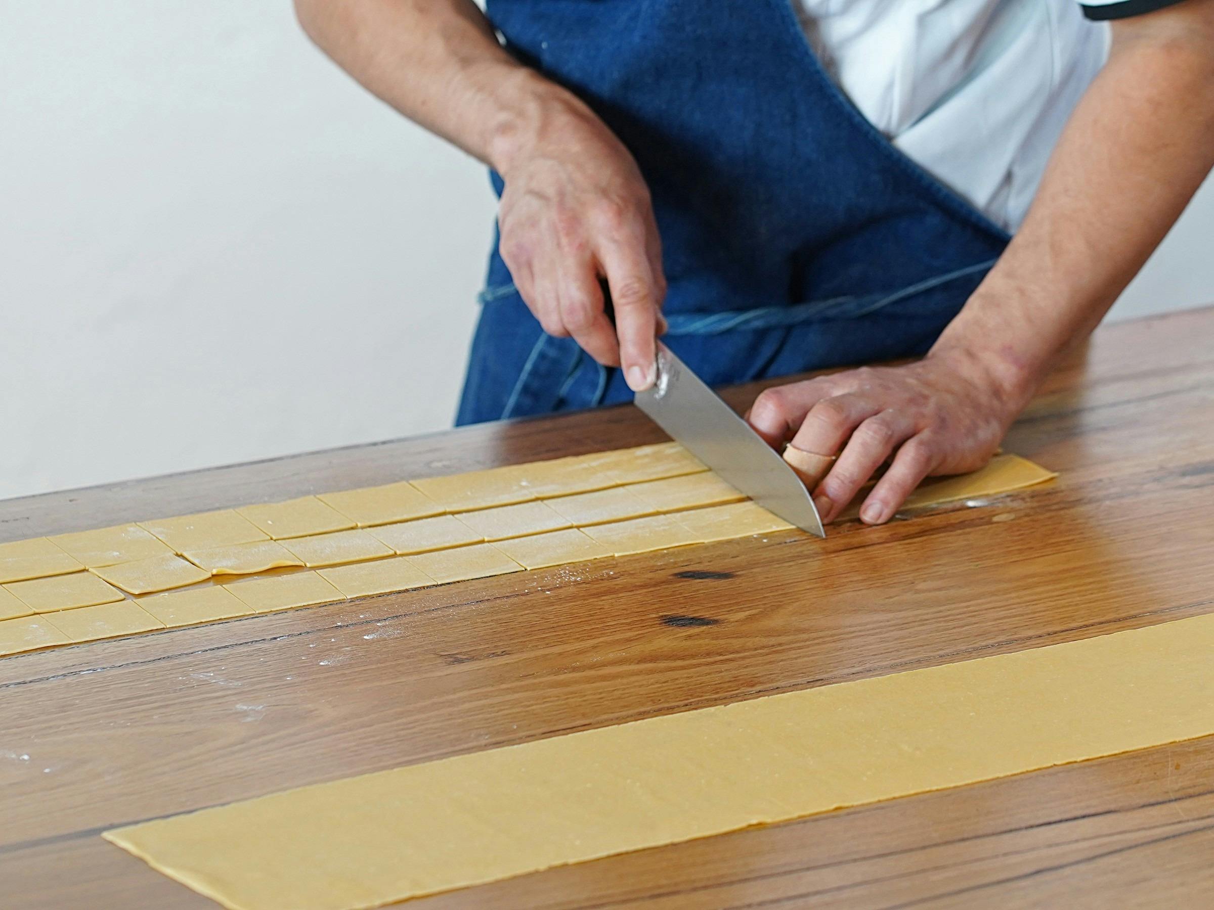 Cutting fresh pasta dough into ribbons by hand