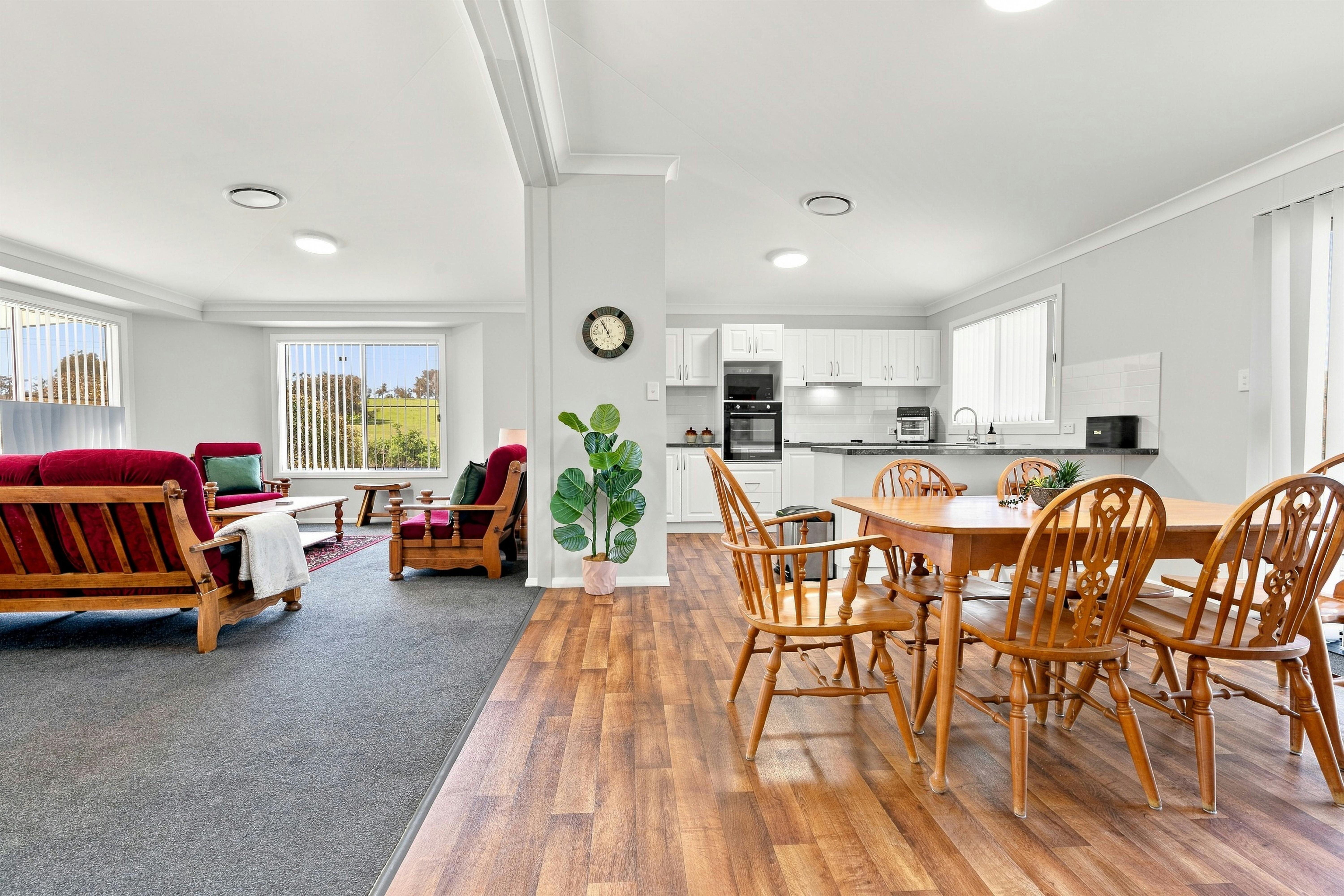 Living area with dining room, lounge area and kitchen