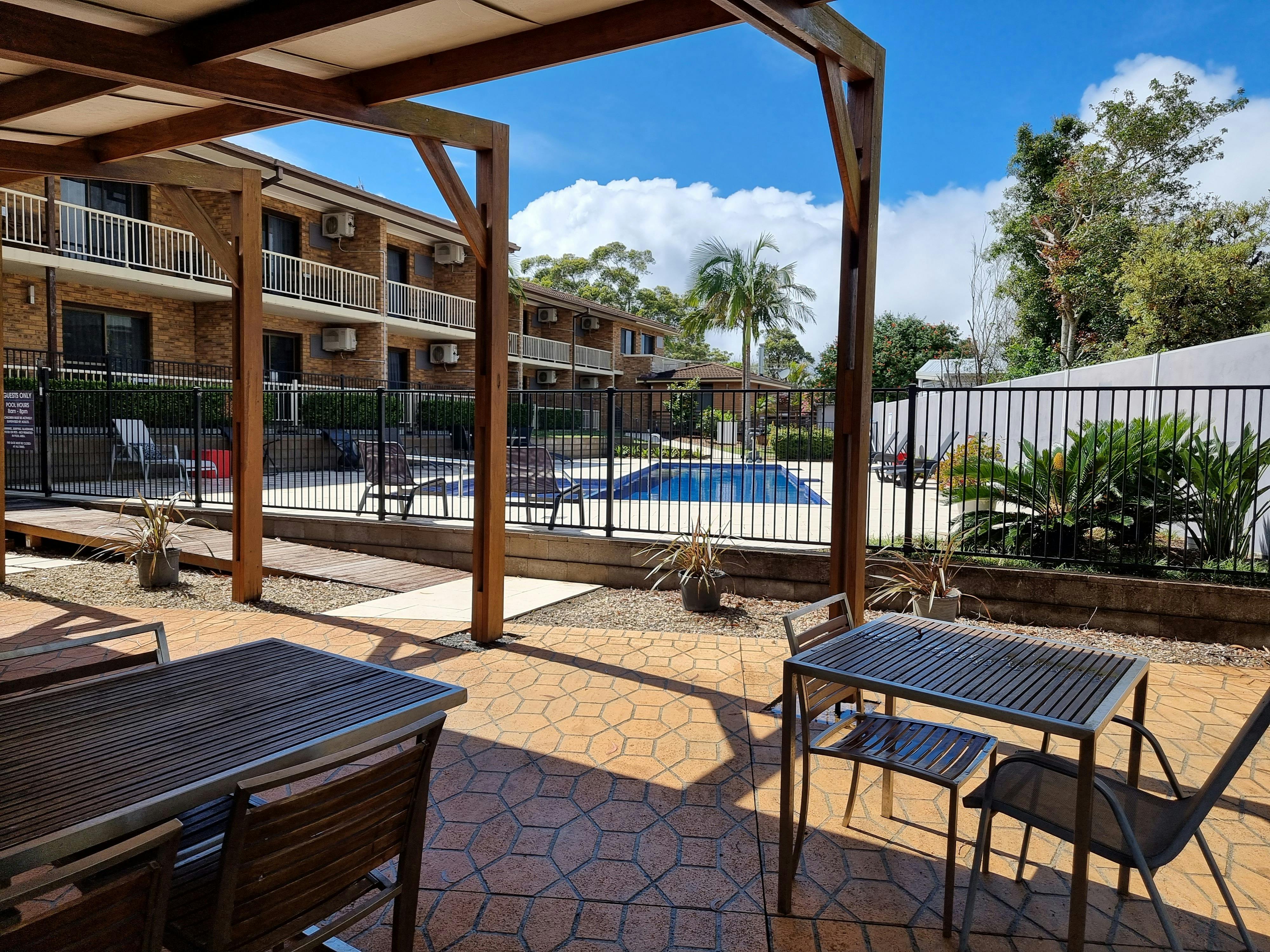 Large undercover area with  a large gas BBQ adjacent to  the resort style pool.