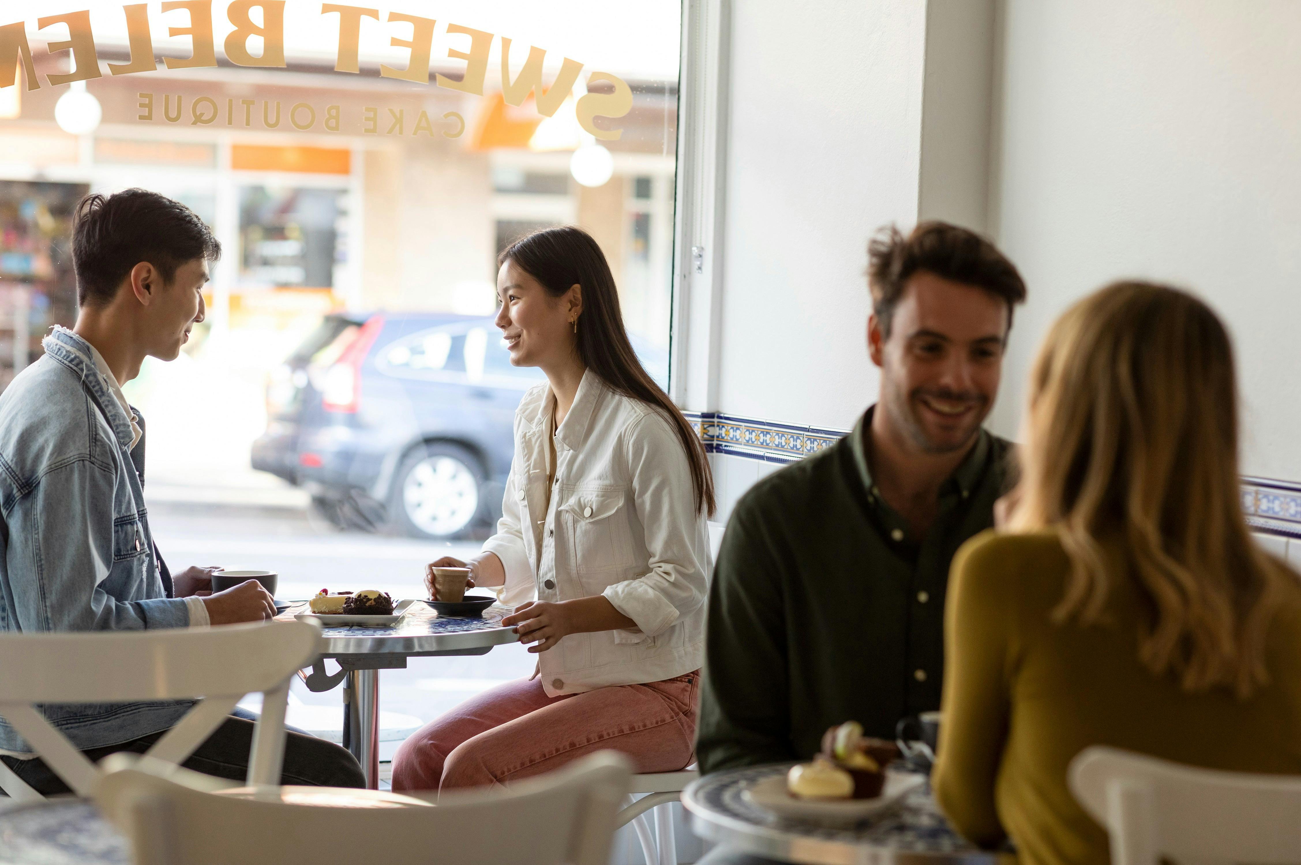 Couple enjoying coffee and dessert at Sweet Belem Cake Boutique, Petersham