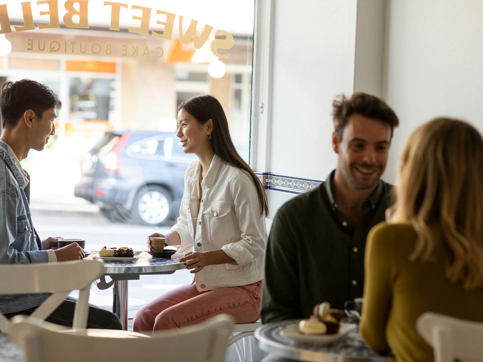 Couple enjoying coffee and dessert at Sweet Belem Cake Boutique, Petersham
