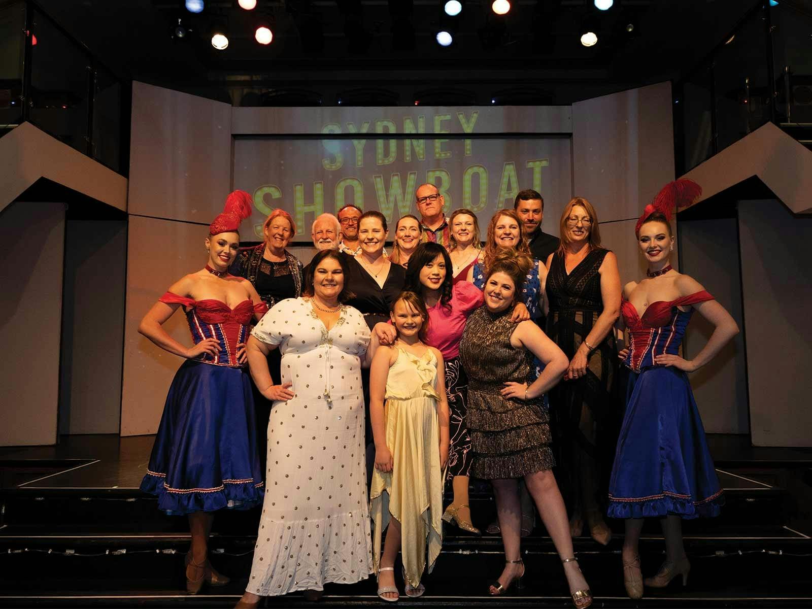 Guests pose with the show girls