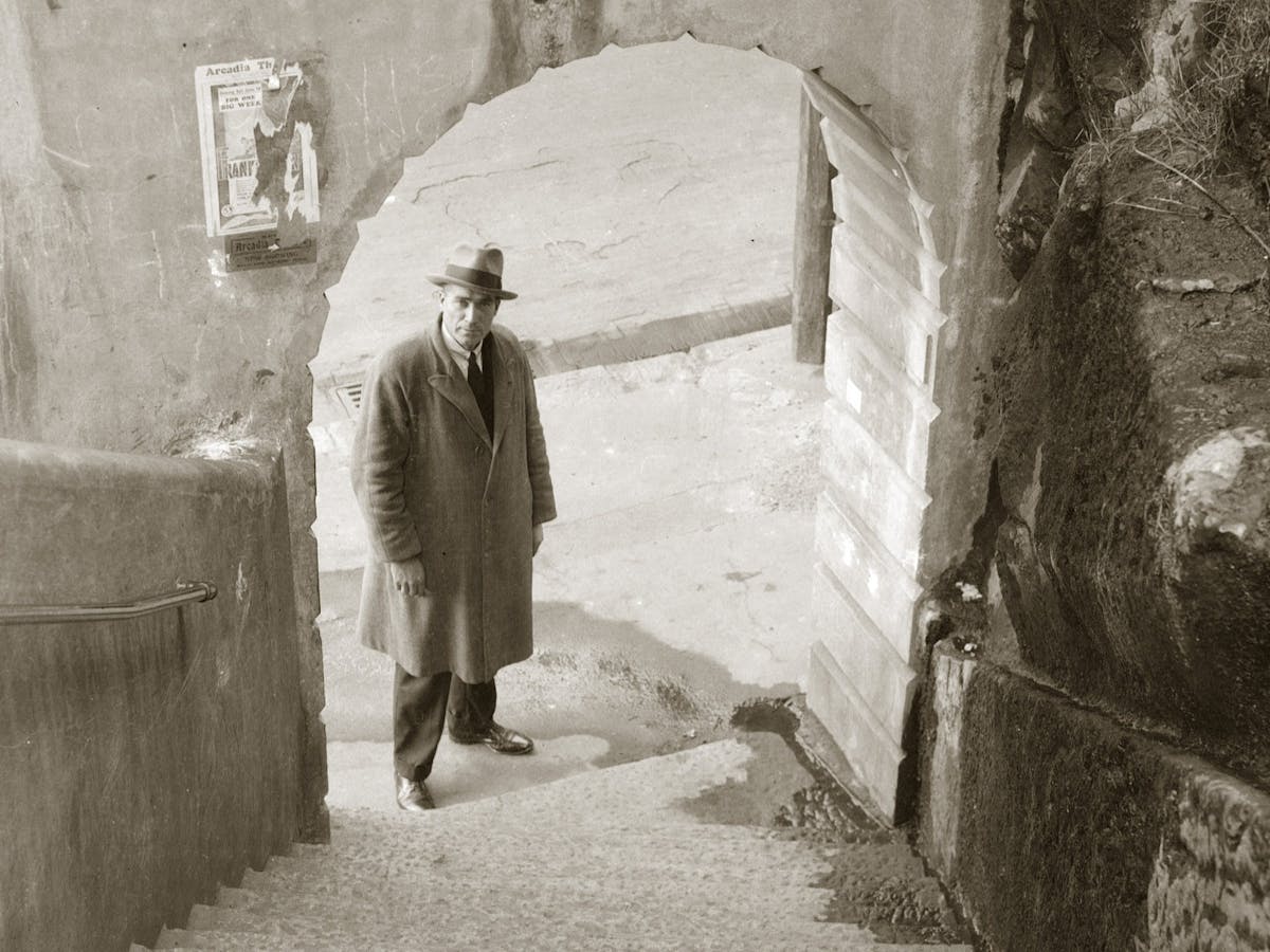 Detective at foot of Argyle Steps, The Rocks (Sydney), late 1930s. Details unknown.