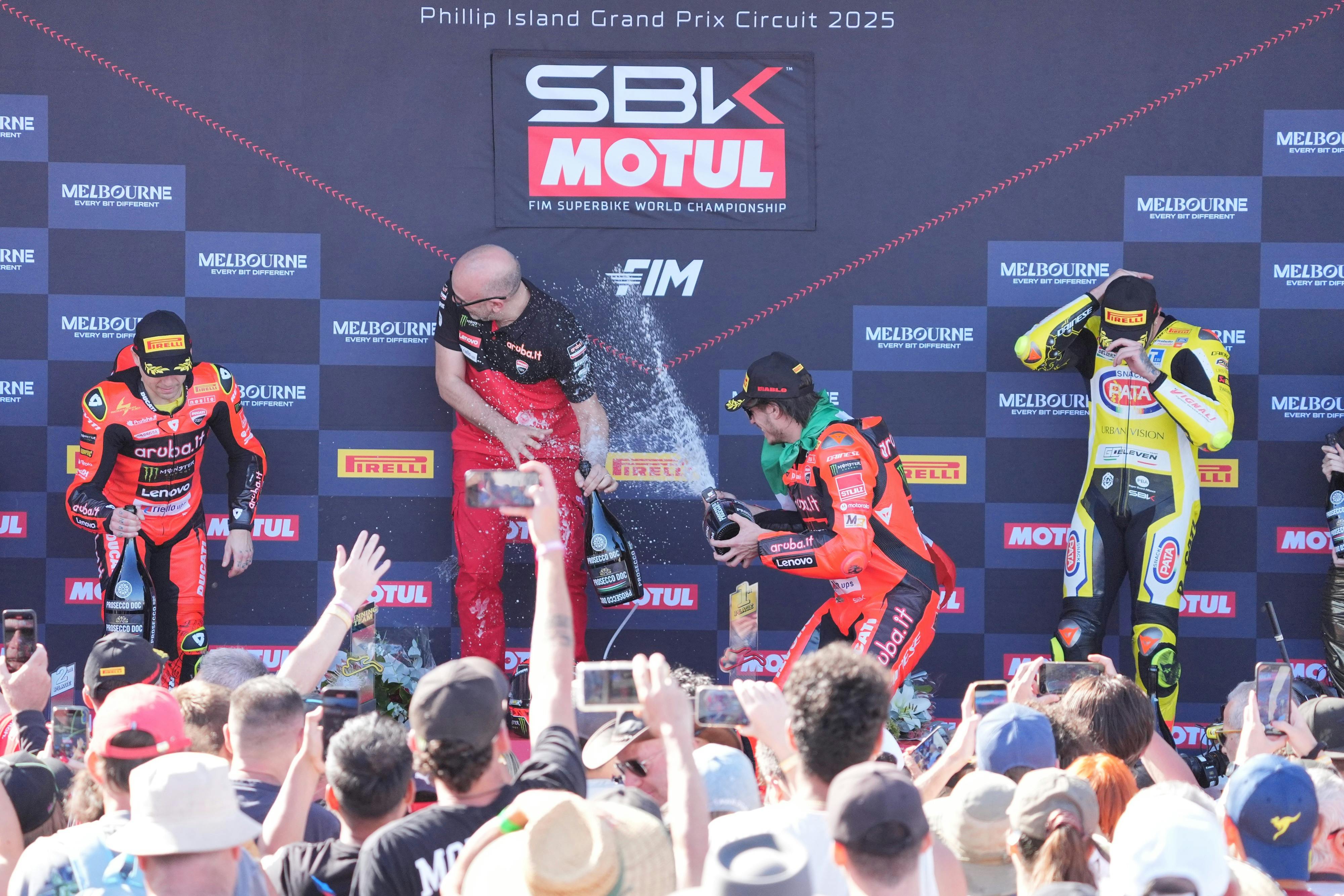 WorldSBK riders celebrating on the podium.