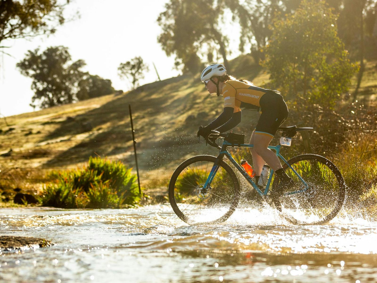 Gravel cycling through a creek in Beechworth